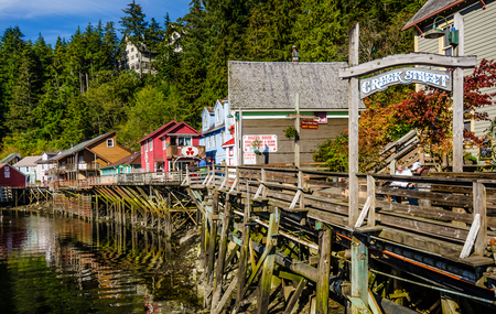 Ketchikan, Alaska, September 12, 2016 - Creek Street is a historic boardwalk perched on pilings along the banks of Ketchikan Creek and infamous for being the cityâs red light district. Today, the buildings house a variety of shops popular with tourists.のeditorial素材