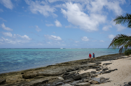Mystery Island, Vanuatu, October 28, 2016 - Tourists walk along the beach of the uninhabited island of the Vanuatu archipelago of 82 volcanic islands in the South Pacific Ocean, a popular day stop for cruise ships.のeditorial素材