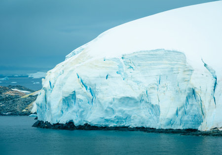 The blue and turquoise hues of the ice and snow along the shoreline of Antarctica are common sights...