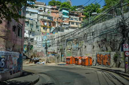 Rio de Janeiro, Brazil, February 28, 2017 - The walls along street in the Rocinha favela  is covered with graffiti and posted messages.のeditorial素材