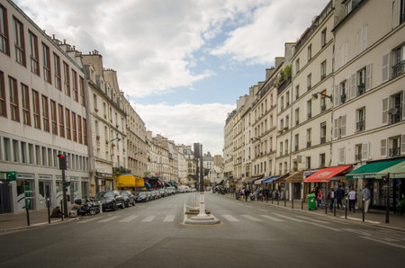 Paris, France, September 5, 2015 - People check out the shops and restaurants that line Rue Du...
