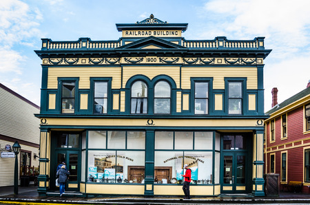 Skagway, Alaska, September 10, 2017 - The Railroad Building is one of many historic storefronts in a town attracting hundreds of gold prospectors and miners arriving every day by steamer from Seattle.のeditorial素材