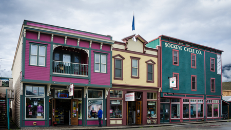 Skagway, Alaska, September 10, 2017 - Colorful storefronts line the street in a town that attracted hundreds of prospectors arriving every day by steamer from Seattle during the Klondike Gold Rush.のeditorial素材