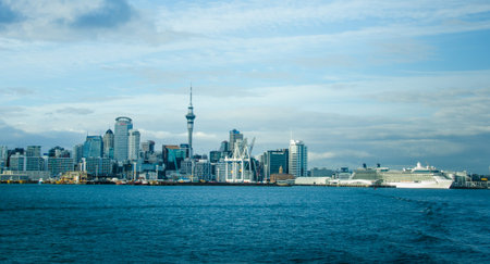 Auckland, New Zealand, December 9, 2017 - The city skyline with a cruise ship moored at the...