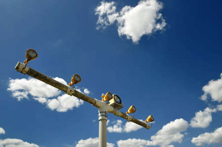 airport floodlight against blue skyの写真素材