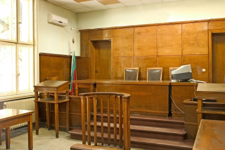 Old vintage wooden court room with judge chairs and a witness stand.の写真素材