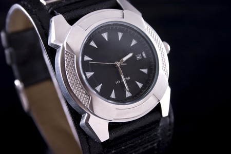 Closeup of luxury chronography watch on black backgroundの写真素材