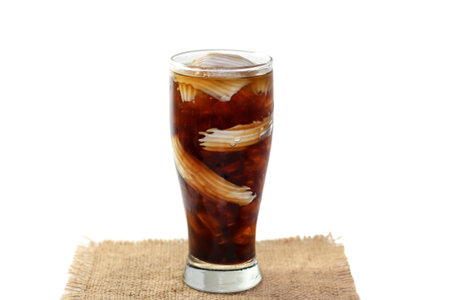 Special menu with Americano ice coffee serving with coconut milk slices and coffee beans spread...