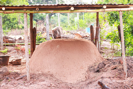 House made of clay on the ground in the garden, Thailand.の写真素材