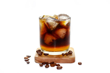cola with ice cubes and coffee beans on a white background.