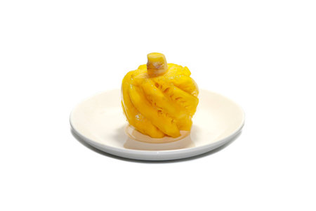Pineapple on a plate isolated on a white background