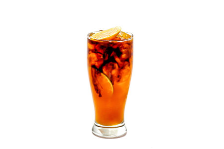 cola with ice cubes and lemon isolated on a white background.の写真素材