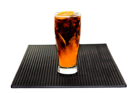 Cuba libre cocktail with orange and iceの写真素材