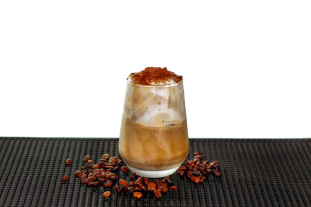 Iced coffee in a glass with coffee beans isolated on a white background