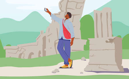 Young Man with Backpack Making Selfie on Smartphone on Ancient Ruins Background . Traveling to Foreign Countryのイラスト素材