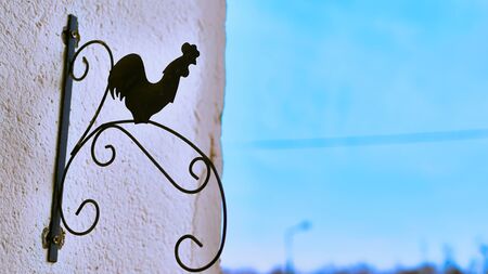 figurine of a rooster made of metal colorの写真素材