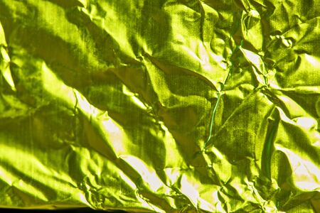 texture of mint foil in green lightの写真素材