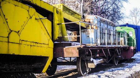 old locomotive with trailer on the railway colorの写真素材
