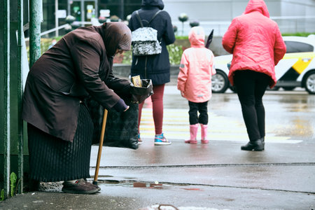 Old woman begs on city street general plan