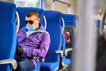 Moscow June 2020 a man in a Medetsin mask sits in the chair of the car of the Moscow central ring....