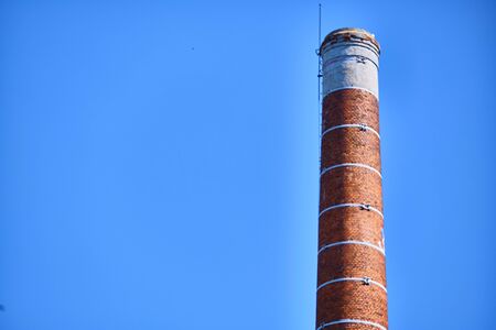 brick pipe against the blue skyの写真素材