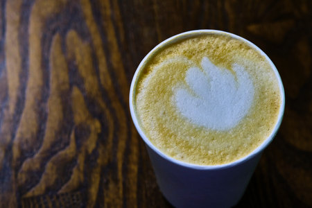 cappuccino in a paper glass view from above