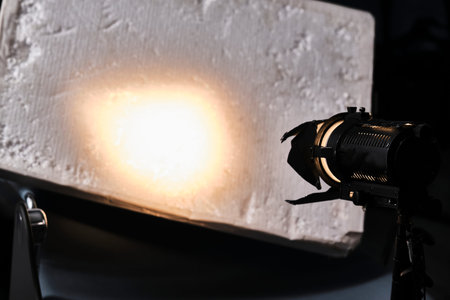 Close-up of a professional lighting fixture on a set or photographic studio. Concept of shooting a movie. colorの写真素材