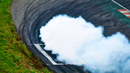 Russia Ryazan International Track Atron September 2020. A sports car in a controlled skid on the track. Smoke billows from under the wheelsのeditorial素材
