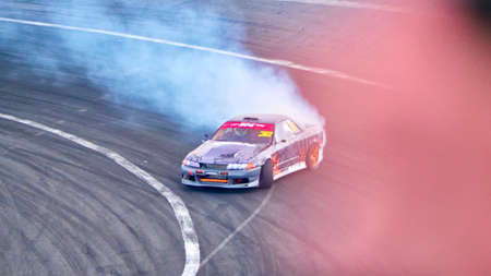 Russia Ryazan International Track Atron September 2020. A sports car in a controlled skid on the track. Smoke billows from under the wheelsのeditorial素材