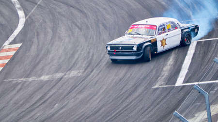 Russia Ryazan International Track Atron September 2020. A sports car in a controlled skid on the track. Smoke billows from under the wheelsのeditorial素材