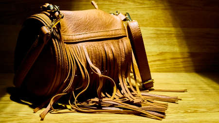 woman's accessories on the wooden table. low light.の写真素材