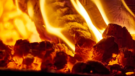 Close up shot of burning firewood in the fireplace.