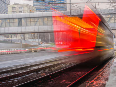 public transport in the city. Tram leaving the station Traffic and lighting, long exposureの写真素材