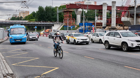 moscow russia 2020. a motorcyclist rides in traffic.のeditorial素材
