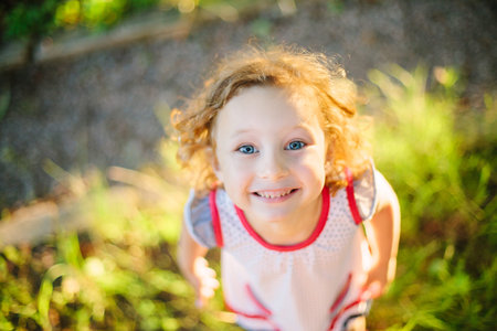 Portrait of a little girl walking in the field