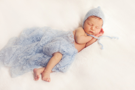healthy newborn baby one week old sleepingの写真素材