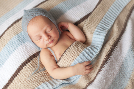 Newborn sleeping baby boy two weeks old, newborn posingの写真素材