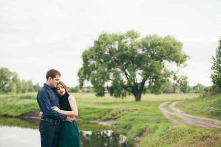 Beautiful young loving couple enjoing good weather in summerの写真素材
