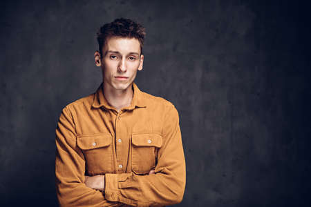 Disappointed caucasian man on dark backgroundの写真素材