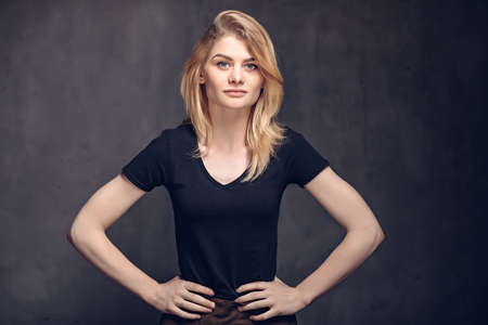 Young caucasian woman with hands on hipsの写真素材