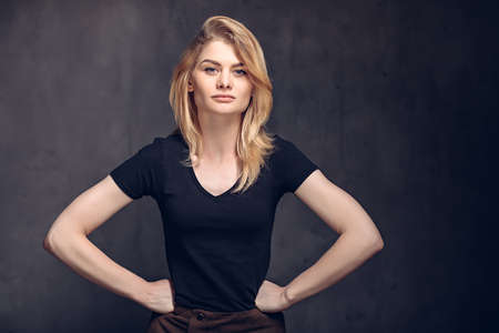 Young caucasian woman with hands on hipsの写真素材