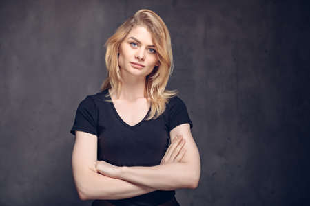 Young caucasian woman with crossed armsの写真素材