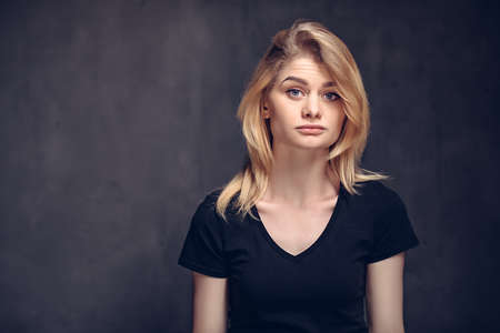 young caucasian woman with skeptical faceの写真素材