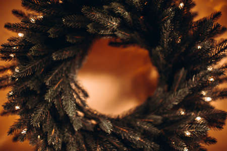 Defocused background image of Christmas wreath on wallの写真素材