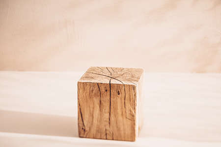The wooden cube as a product display. A podium for advertising layouts with your productの写真素材