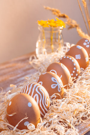 Painted with natural white paint Easter eggs in sunlightの写真素材