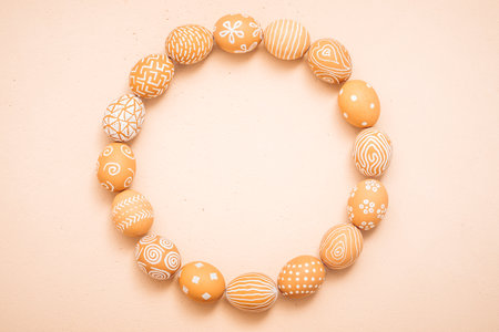 Rustic Easter eggs round frame on a clay texture.の写真素材