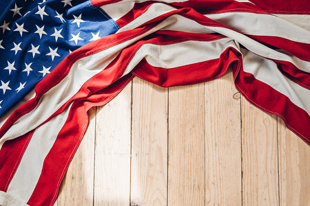 American flag on a wooden texture. 4th of July, US Independence Day and Memorial Day backgroundの写真素材