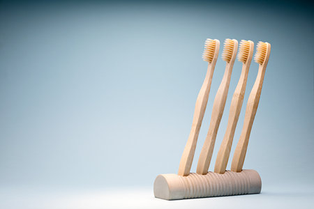 Eco-friendly wooden toothbrushes in a concrete standの写真素材
