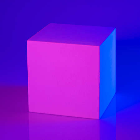 Gypsum cube in pink and blue neon lightの写真素材